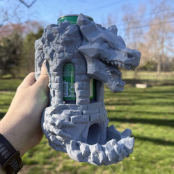 Unpainted grey Dragon’s Fortress Can Holder and Dice Tower with dragon motif and stonework design for tabletop gaming