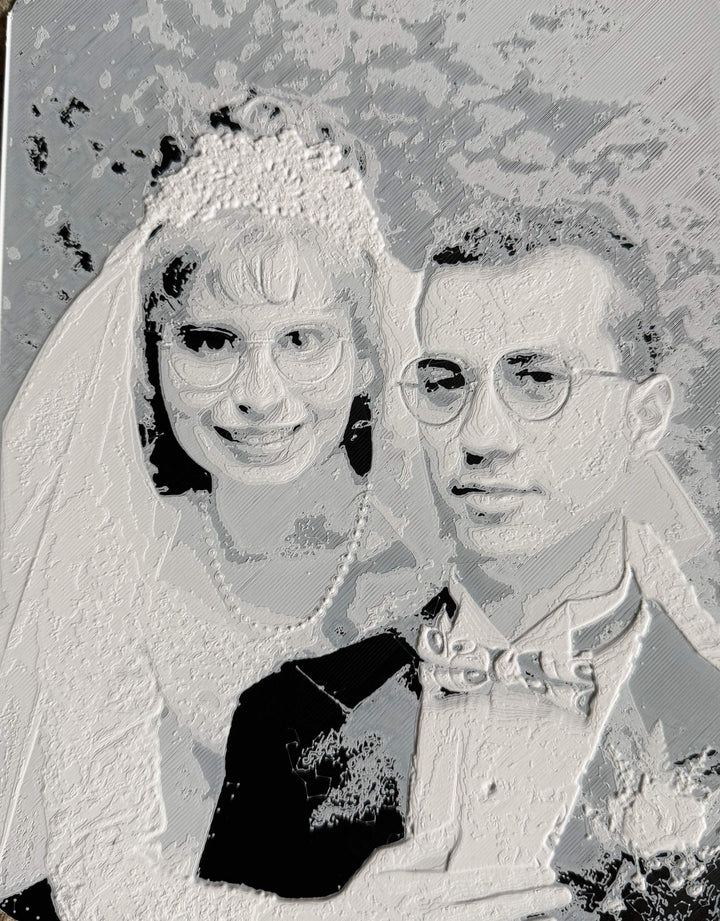 Custom 3D printed photo relief of a couple capturing detailed textures and personalized design
