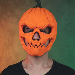 Pumpkin Head Mask in bright orange with a dark green stem, carved eye openings and a jagged toothy grin