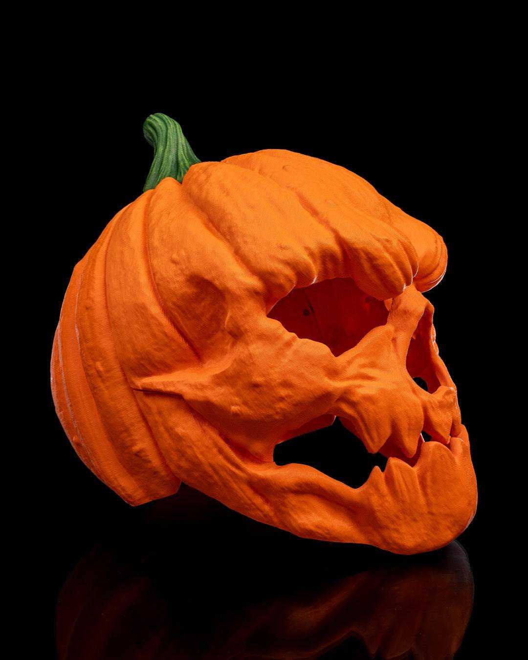 Pumpkin Head Mask in textured orange with a green stem and sculpted jagged eye and mouth openings