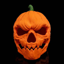 Pumpkin Head Mask in textured orange with a green stem, featuring deep eye and nose holes and jagged teeth
